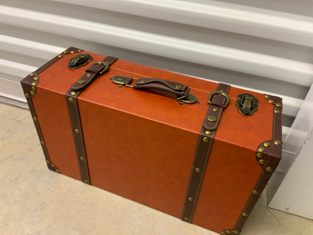 Orange small suitcase