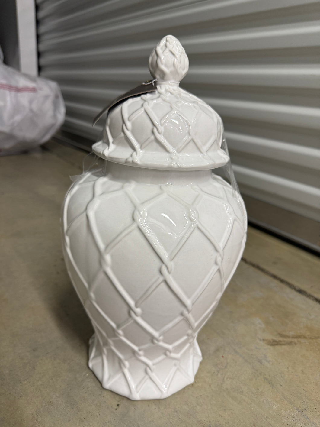 White lattice ceramic lidded vase